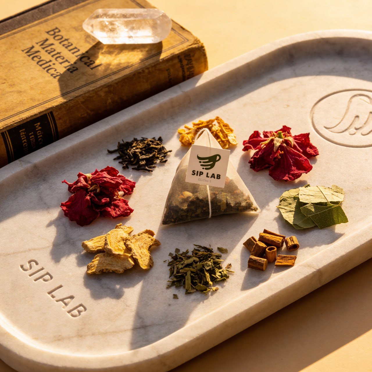 GLTea-1 botanical ingredients on marble tray